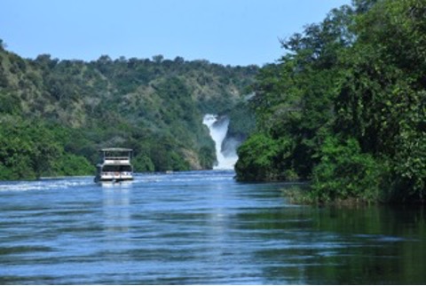 Waterfalls with a tourist boat in the distance