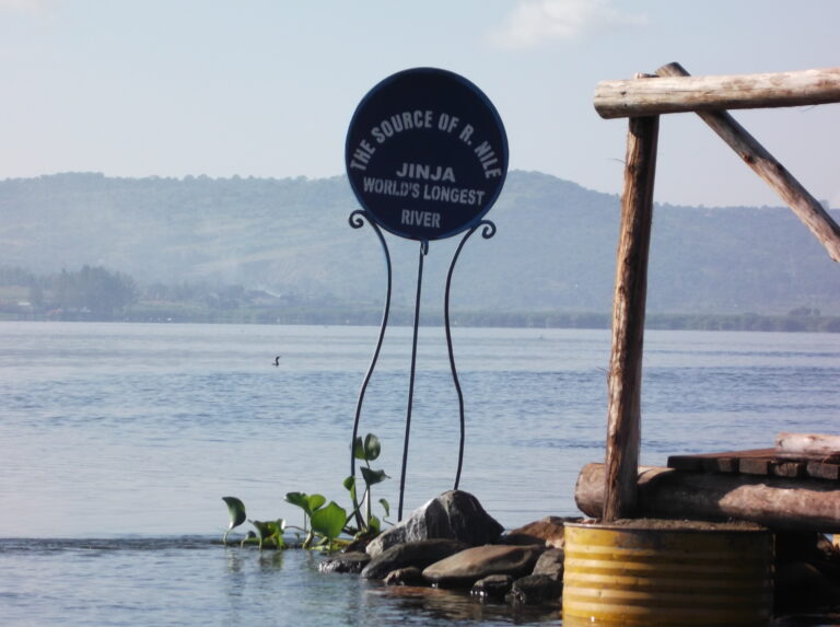 A sign that reads "Jinja the world's longest river"
