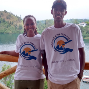 Two individuals wearing the logo shirts